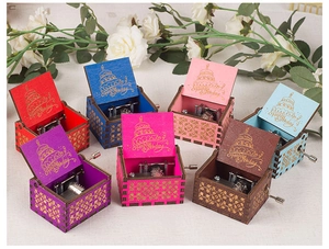 Group of 8 colorful hand-cranked wooden music boxes with Happy Birthday engravings