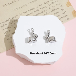 Macro view of rabbit silver pendants for DIY jewelry with size marking 14x20mm