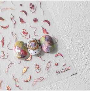 Macro detail of M-207 self-adhesive nail stickers with red metallic abstract lines
