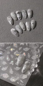 Macro detail of M-327 nail stickers with elegant white swan, rose, and feather patterns