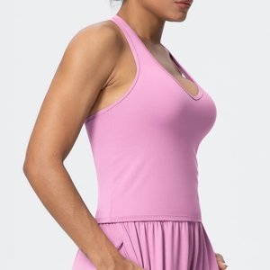 Close-up of pink V-neck sports bra and shorts showing seamless quick-dry fabric texture
