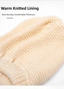 Detail of warm knitted lining with thick texture and uniform density on beige beanie