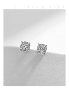 Macro detail of S925 sterling silver moissanite stud earrings with a halo diamond design