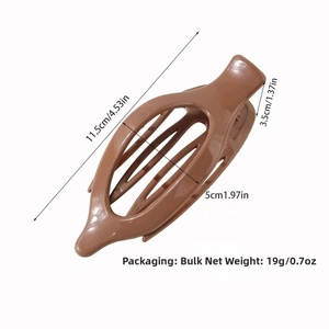 Detailed view of a brown banana hair clip showing 11.5cm length and 19g weight specs