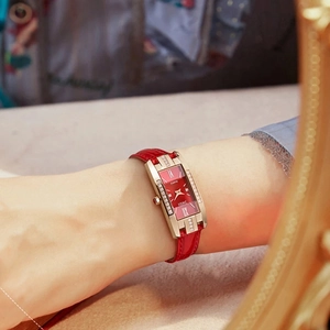Elegant rectangular women's quartz watch with red leather strap and diamond-set case