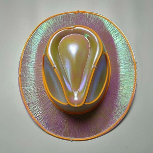 Macro detail of holographic iridescent finish and orange LED wire on the cowboy hat