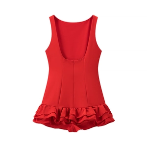 Detail of red sleeveless backless dress featuring multi-layered ruffled hemline