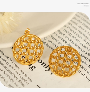 Macro detail of French style gold-plated chain link mesh hollow design stud earrings