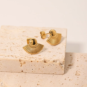 Elegant 18K gold-plated fan-shaped titanium steel earrings displayed on beige stone pedestal