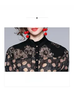 Detailed view of the stand collar with floral print and black lace shoulder stitching