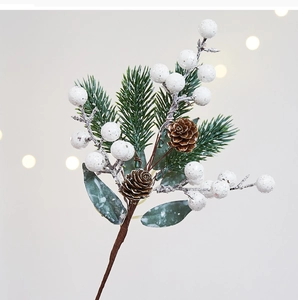 Macro view of Christmas branch with white berries, pine needles, and pinecones decoration
