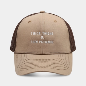 Close-up of Richardson style trucker hat with embroidered slogan and breathable mesh back