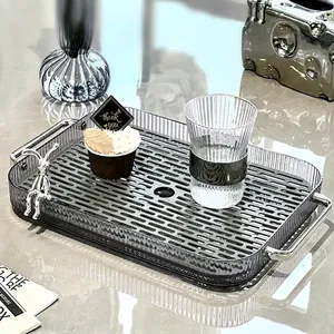 Rectangular grey tea tray with silver handles, rabbit decor and drainage layer