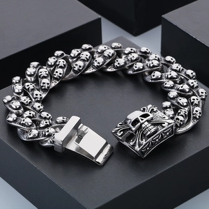 Men's gothic skull head Cuban chain bracelet in vintage distressed stainless steel finish