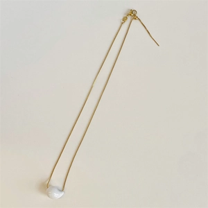 Detailed view of the gold-plated teardrop pendant on a fine adjustable box chain