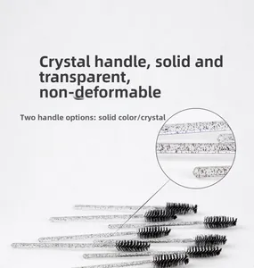 Macro detail of disposable crystal handle mascara wands with black spiral fiber bristles