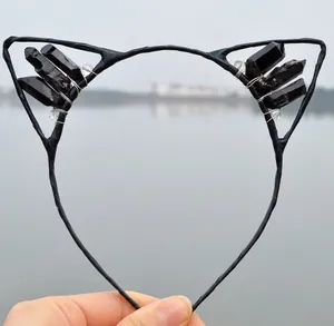 Detail of black crystal cat ear headband with wire-wrapped quartz and dark style accents