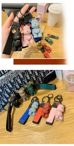 Detailed macro view of colorful bear keychains with matching leather wrist straps