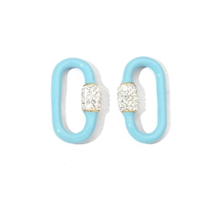 Detail view of blue oval chain earrings with gold accents and clear crystal stones