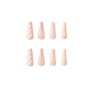 Pink and white Christmas glitter press-on nails with heart and sweater texture patterns