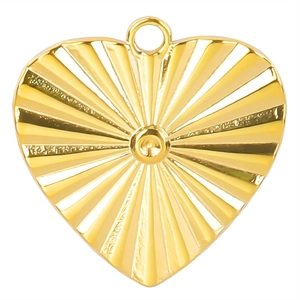 Detailed close-up of a 18k gold-plated heart pendant with sunburst radial texture