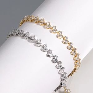 Minimalist full zircon tennis bracelet in gold and silver finish on white props