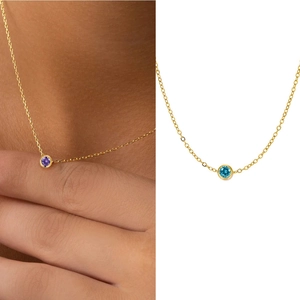 Titanium gold necklace with circular gemstone pendants in purple and blue options