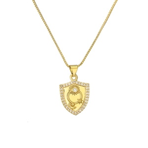 Elegant gold shield necklace featuring sun and moon zircon pendant on a thin box chain