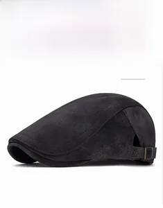 Detail showing the adjustable metal buckle and dark gray faux suede texture on the cap
