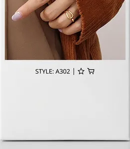 Detailed close-up of a hollow chain style gold ring on a finger with a matte finish