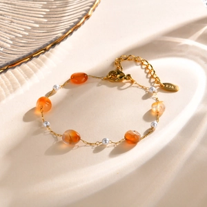 Detail view of gold lobster clasp and adjustable extension chain with K18 tag