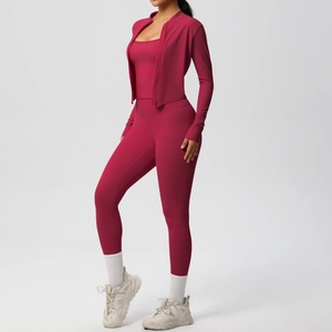 Three-piece berry pink yoga set with zip-up jacket, sports bra, and high-waisted leggings