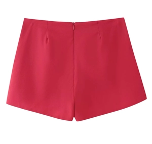 Short rose cintré à taille haute avec fermeture éclair invisible au dos et texture tissée