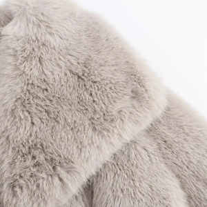 Macro shot of high-quality light grey faux fur fabric showing soft plush texture details