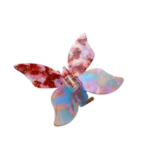 Elegant butterfly acetate hair claw clip with colorful floral pattern on white background