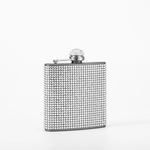 Close-up of a 6oz stainless steel hip flask covered in sparkling silver rhinestones