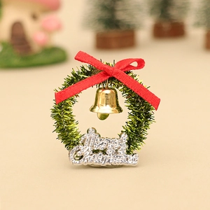 Miniature Christmas wreath with red bow and golden bell for dollhouse decoration