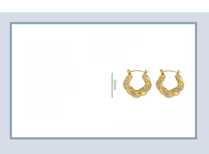 Detailed view of 18k gold-plated twisted hoop earrings with crystals and size parameters