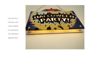 Detail of Halloween party LED door sign showing 3D wooden layers and spooky graveyard art