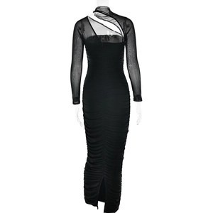 Detail of sheer mesh panel and cutout on the back of a black ruched bodycon dress