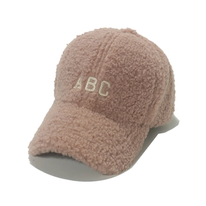 Pink lamb wool baseball cap featuring white ABC letter embroidery and curved brim