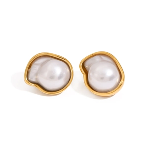 Baroque pearl earrings with golden metal frames in vintage minimalist style