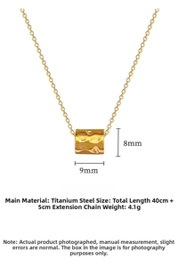Detailed view of gold cylinder pendant with hammered texture and dimensions 9x8mm