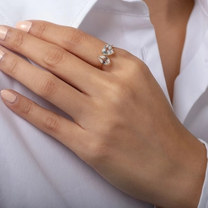 Detail of adjustable gold ring featuring two sparkling pear-shaped cubic zirconia stones