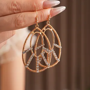 Bohemian gold drop hollow earrings with rhinestones and vintage filigree design
