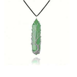 Handmade silver wire-wrapped tree of life crystal necklace with green quartz pendant