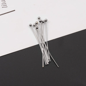 Macro shot of silver stainless steel ball head pins for DIY jewelry making and beading