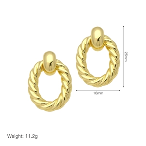 Detailed view of gold twisted hoop earrings with 25mm height and 18mm width dimensions