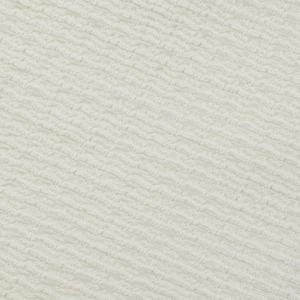 Gros plan sur le tissu blanc évidé avec une texture gaufrée et des couches détaillées