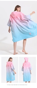 Back view of quick-dry hooded beach poncho featuring pink-blue gradient and palm tree print